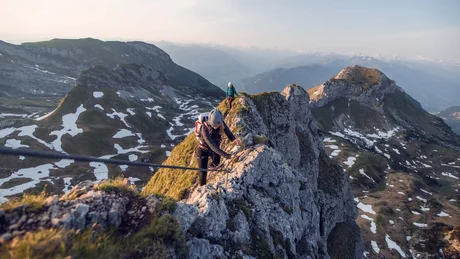 Wiesenhof from all perspectives Two climbers securing themselves while climbing a narrow rocky mountain ridge